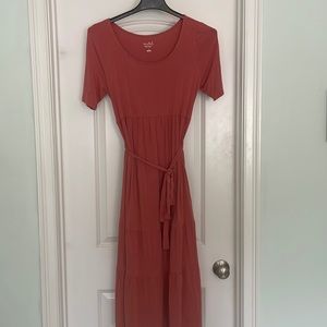 Maternity Dress. color is a pinkish rust